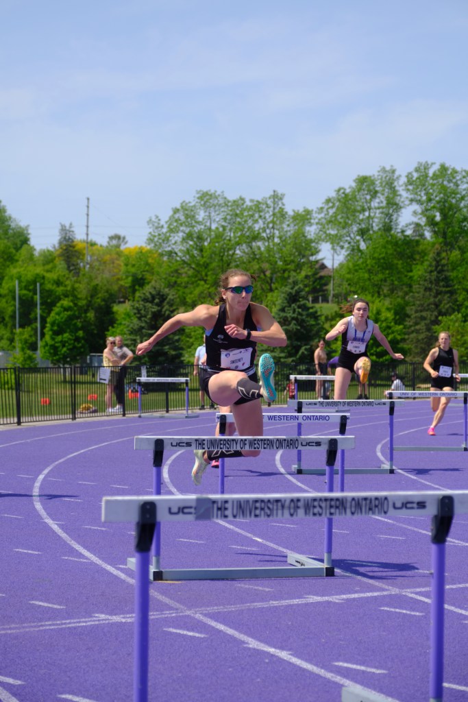 Spitfire's hurdler Sierra Sweeney clearing a hurdle at the Bob Vigars Classic in London, Ont. on May 28, 2023. Photo taken by Davis Rutledge. 